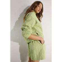 Load image into Gallery viewer, Apple green embossed lounge shorts with relaxed fit and textured fabric styled as part of a matching set.

