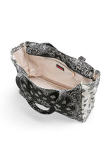Load image into Gallery viewer, Black and white bandana print oversized tote bag featuring a bold paisley pattern, spacious interior, and double shoulder straps for everyday use.
