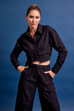 Load image into Gallery viewer, Structured black cropped cargo jacket with stretch and utility pockets. A polished, fashion-forward layer. Matching cargo pants sold separately.

