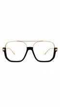 Load image into Gallery viewer, Black and gold oversized aviator-style optical frames with clear lenses, shown on a model and on a white background.
