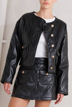 Load image into Gallery viewer, Glam Expressway Black leather jacket with gold buttons worn by a person on a plain background
