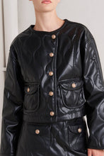 Load image into Gallery viewer, Glam Expressway Black leather jacket with gold buttons worn by a person against a neutral background
