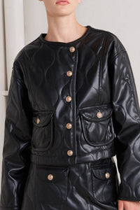 Glam Expressway Black leather jacket with gold buttons worn by a person against a neutral background