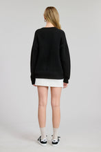 Load image into Gallery viewer, Person wearing a black sweater and white skirt on a plain background
