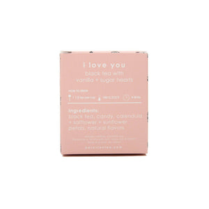 Pink packaging of black tea with vanilla and sugar heads on a white background