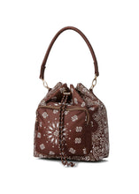 Load image into Gallery viewer, Walnut brown bandana print convertible bucket bag with drawstring closure and adjustable straps that can be worn as a backpack, shoulder bag, or crossbody bag.
