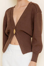 Load image into Gallery viewer, Brown knitted cardigan worn by a person on a plain background
