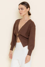Load image into Gallery viewer, Woman wearing a brown cropped cardigan over a white top against a beige background
