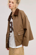 Load image into Gallery viewer, Utility-style lined jacket with a contrasting corduroy point collar, front snap closure, and front snap-flap patch pockets, designed with a boxy and oversized silhouette.
