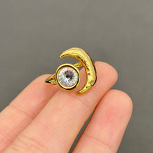 Load image into Gallery viewer, 18K gold-plated stainless steel ring featuring a sculptural crescent moon and large round clear zircon stone.
