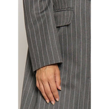 Load image into Gallery viewer, Gray pinstripe suit with a hand resting on the lapel against a white background
