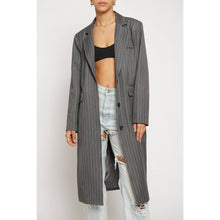 Load image into Gallery viewer, Person wearing a long gray pinstripe coat over a black crop top and light blue jeans on a white background
