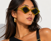 Load image into Gallery viewer, Close-up of chartreuse diamond sunglasses showing the angular frame and tinted lenses.
