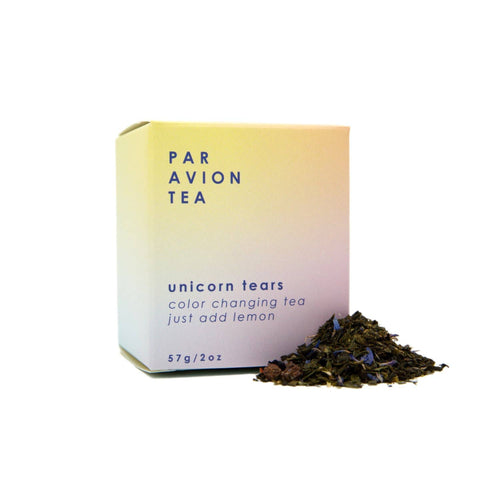 Par Avion Tea unicorn tears packaging with loose tea leaves on a white background