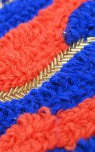 Load image into Gallery viewer, Close-up of red, blue, and gold braided cord design on a shoulder bag.

