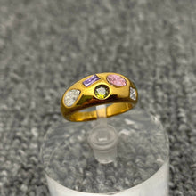Load image into Gallery viewer, 18K gold-plated stainless steel dome ring featuring multicolor cubic zirconia stones in pink, green, purple and clear geometric shapes.
