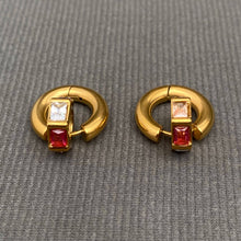 Load image into Gallery viewer, 18K gold-plated stainless steel huggie earrings featuring colorful pink and green zircon accents in geometric settings.
