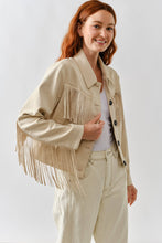 Load image into Gallery viewer, Woman wearing a beige fringed jacket on a white background
