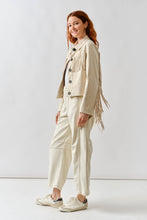 Load image into Gallery viewer, Woman wearing a beige fringed jacket and pants on a white background
