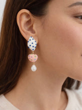 Load image into Gallery viewer, Mismatched colorful statement earrings with crystal accents and pearl drop photographed on a model from Glam Expressway Boutique.
