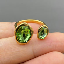 Load image into Gallery viewer, Adjustable 18K gold-plated stainless steel open ring featuring two asymmetrical faceted green zircon stones.
