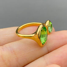 Load image into Gallery viewer, Adjustable 18K gold-plated stainless steel open ring featuring two asymmetrical faceted green zircon stones.
