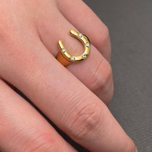 Load image into Gallery viewer, Gold-plated statement ring featuring a polished sculptural horseshoe design.
