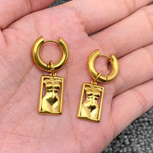 Load image into Gallery viewer, 18K gold-plated stainless steel huggie earrings with rectangular sculptural female body charms and a high-polish finish.
