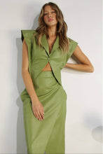Load image into Gallery viewer, Woman wearing a green leather Glam Expressway dress against a white background
