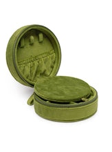 Load image into Gallery viewer, Round olive green velvet jewelry travel case with embroidered pink martini glass, zip-around closure, built-in mirror, ring rolls, and compartments for storing rings, earrings, necklaces, and bracelets.
