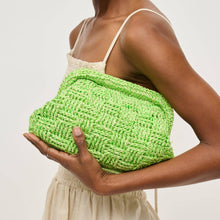 Load image into Gallery viewer, Person holding a green woven clutch bag against a neutral background.
