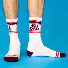 Load image into Gallery viewer, White Hot Dad gym crew socks featuring burgundy HOT DAD lettering, retro red and burgundy athletic stripes, and contrasting burgundy heels and toes.
