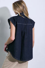 Load image into Gallery viewer, Introducing our stylish denim top, a versatile wardrobe essential. This trendy piece boasts a classic shirt collar and a convenient snap button-down front, making it both chic and easy to wear. The sleeveless design adds a touch of modern flair, perfect for warmer days or layering with your favorite jacket. Complete with front pockets for added functionality and style, this denim top effortlessly combines fashion and comfort for a timeless look.

