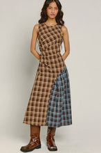 Load image into Gallery viewer, Sustainable recycled-fabric midi dress featuring contrasting brown and blue plaid panels, a sleeveless silhouette and asymmetrical draped design.
