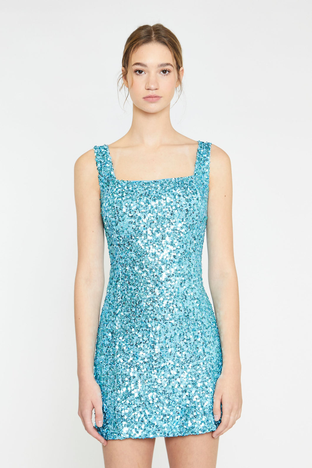 Our glamorous Aqua Blue Sequin Mini Dress adds the perfect pop of color to your event. This statement dress is sophisticated, gorgeous and well made. Fully lined, sleeveless with a zipper closure in the back and some stretch in the fabric. Wear our Aqua Blue Sequin Mini Dress with heels or boots whenever you want to shine.