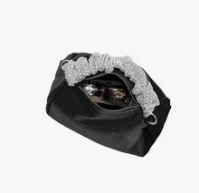 Load image into Gallery viewer, Upgrade your accessory game with the Crystal Top Handle Black Velvet Bag. This gorgeous evening bag is a statement piece designed to keep you stylish and organized throughout the holiday season. Our crystal handle velvet bag effortlessly combines fashion and function, making it your ideal companion for any occasion.
