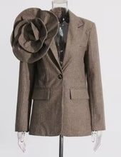 Load image into Gallery viewer, Introducing the Tweed Blazer with 3D Flower—a chic blend of classic and bold! Crafted from luxurious twill woolen fabric, this single-button blazer features a notched lapel and a stunning oversized detachable 3D flower that adds a dramatic flair. Perfect for making a statement, it combines sophistication and uniqueness, allowing you to switch up your look with ease. Dress it up for work or a night out—this piece guarantees to turn heads! Available now in women&#39;s sizes.
