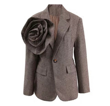 Load image into Gallery viewer, Introducing the Tweed Blazer with 3D Flower—a chic blend of classic and bold! Crafted from luxurious twill woolen fabric, this single-button blazer features a notched lapel and a stunning oversized detachable 3D flower that adds a dramatic flair. Perfect for making a statement, it combines sophistication and uniqueness, allowing you to switch up your look with ease. Dress it up for work or a night out—this piece guarantees to turn heads! Available now in women&#39;s sizes.
