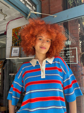 Load image into Gallery viewer, Short-sleeve multicolored striped polo shirt with red, blue, and cream stripes, soft knit fabric, and contrasting cream collar - stylish and comfortable women’s preppy polo top, perfect for summer outfits, easy casual wear, or elevated everyday fashion; available now at Glam Expressway.
