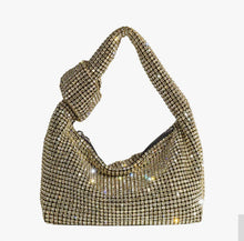 Load image into Gallery viewer, Add some sparkle to your holiday look with the Gold Crystal Evening Bag. Made with crystals and a top handle, this stylish bag features a shiny, bling-inspired silhouette that is sure to add some extra glamour to any occasion.
