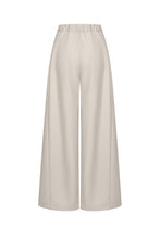 Load image into Gallery viewer, Ivory draped twill wide-leg pants with front pleats, high waist and full-length flowing silhouette on a white background.
