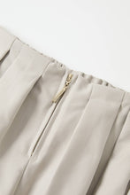 Load image into Gallery viewer, Ivory draped twill wide-leg pants with front pleats, high waist and full-length flowing silhouette on a white background.
