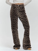 Load image into Gallery viewer, Unleash your wild side with our Retro Streetwear Leopard Print Trousers. Made from 100% cotton, these low-rise denim pants deliver bold style with a nod to classic streetwear vibes. The edgy leopard print makes them a statement piece, perfect for turning heads wherever you go.
