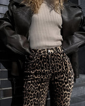 Load image into Gallery viewer, Unleash your wild side with our Retro Streetwear Leopard Print Trousers. Made from 100% cotton, these low-rise denim pants deliver bold style with a nod to classic streetwear vibes. The edgy leopard print makes them a statement piece, perfect for turning heads wherever you go.
