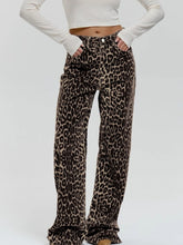 Load image into Gallery viewer, Unleash your wild side with our Retro Streetwear Leopard Print Trousers. Made from 100% cotton, these low-rise denim pants deliver bold style with a nod to classic streetwear vibes. The edgy leopard print makes them a statement piece, perfect for turning heads wherever you go.
