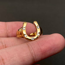 Load image into Gallery viewer, Gold-plated statement ring featuring a polished sculptural horseshoe design.
