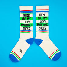 Load image into Gallery viewer, Pair of cream Lucky Mahjong gym crew socks featuring “These Are My Lucky Mahjong Socks” lettering, green, red and blue athletic stripes, and contrasting bright blue heels and toes on a blue background.
