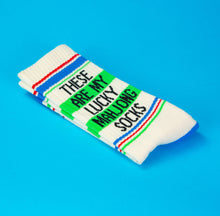 Load image into Gallery viewer, Pair of cream Lucky Mahjong gym crew socks featuring “These Are My Lucky Mahjong Socks” lettering, green, red and blue athletic stripes, and contrasting bright blue heels and toes on a blue background.
