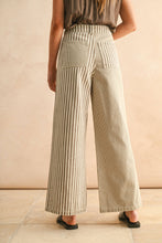 Load image into Gallery viewer, Person wearing beige mixed striped wide-leg pants against a beige background
