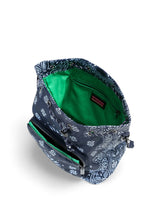 Load image into Gallery viewer, Navy blue bandana print convertible bucket bag with drawstring closure and adjustable straps that can be worn as a backpack, shoulder bag, or crossbody bag.
